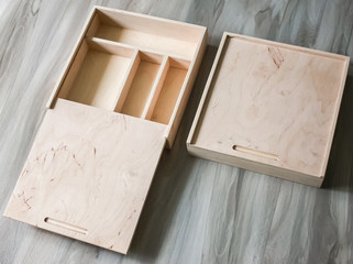 Empty wooden box with compartments for storing jewelry, gifts, souvenirs, money, photographs for photographers. product material - plywood. wood case place for goods in the store for small things.