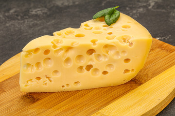 Maasdam cheese - yellow triangle with holes