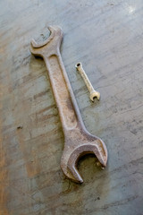 big and small wrench on iron rough background in grunge style. Top view. Mock up. Flat lay composition