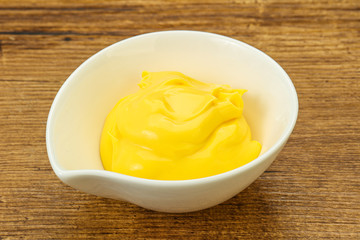 Natural cheese sauce in the bowl