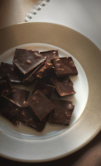 dark chocolate with nuts on the plate