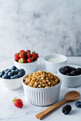 Nuts oatmeal granola with berries in a bowl