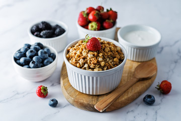 Nuts oatmeal granola with berries in a bowl