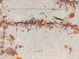 Reinforced concrete surface is covered with cracks, scratches, inclusions of granite and rusty metal bars. You can use as the background for any of your project.