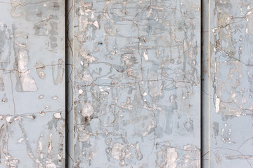 Background concrete wall, traces of weathering, worn wall damaged paint old paint. Remains of old paint on the painted concrete surface. Grungy concrete surface.