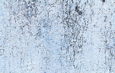 Background concrete wall, traces of weathering, worn wall damaged paint old paint. Remains of old paint on the painted concrete surface. Grungy concrete surface.