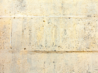 Background concrete wall, traces of weathering, worn wall damaged paint old paint. Remains of old paint on the painted concrete surface. Grungy concrete surface.