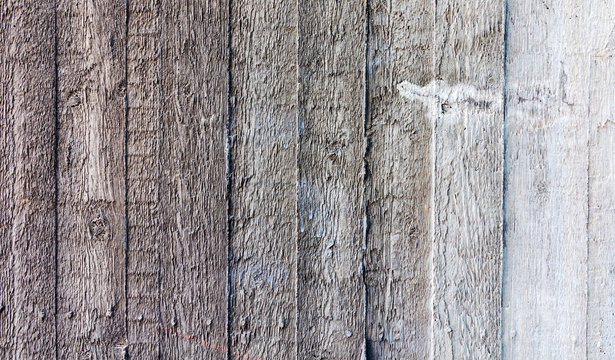 Creative unusual background of the cement wall with the imprint of the texture of wooden Board formwork. The texture of the wooden slats of the wood Board on the cement.