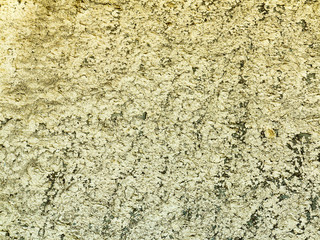 Background concrete wall, traces of weathering, worn wall damaged paint old paint. Remains of old paint on the painted concrete surface. Grungy concrete surface.