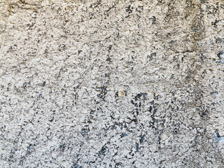 Background concrete wall, traces of weathering, worn wall damaged paint old paint. Remains of old paint on the painted concrete surface. Grungy concrete surface.