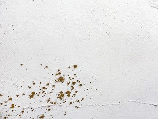 Background concrete wall, traces of weathering, worn wall damaged paint old paint. Remains of old paint on the painted concrete surface. Grungy concrete surface.