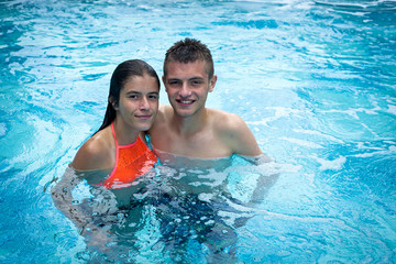 young people enjoy the pool