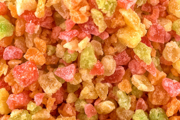 Sweet candied fruit background, closeup, copy space