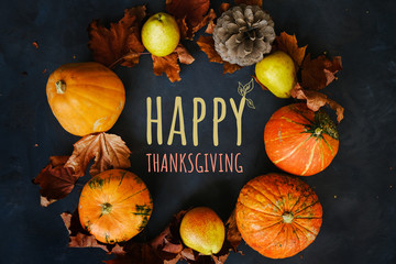 Happy thanksgiving day background. Autumn frame made of pumpkins, maple leaves, pears and pine cone.