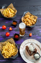 beer snacks. potato wedges, fried dumplings, garlic croutons with tartar sauce, french fries.