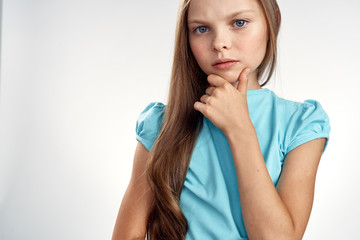 cute girl blue dresses cropped view light background emotions childhood fun