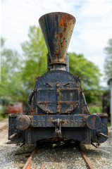 Fototapeta premium Front view of an old rusty steam locomotive in Austria