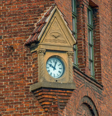 Fototapeta premium A wall clock in the district of Nyhavn in Copenhagen, Denmark in the summertime