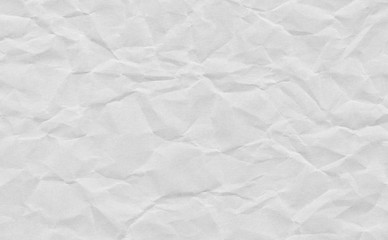Closeup crumpled grunge grey paper  texture background. Light grey paper sheet with space for text ,pattern or abstract background.