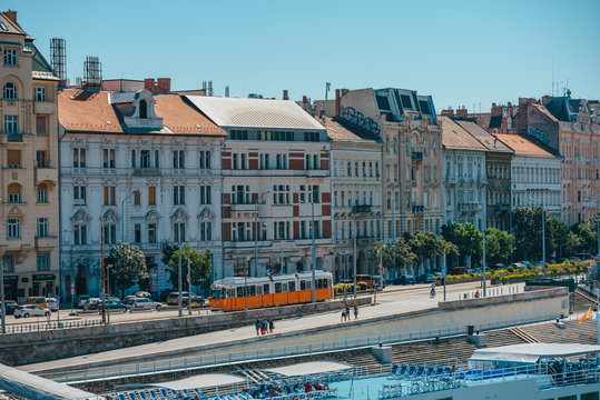 BUDAPEST, HUNGARY, AUGUST 2, 2020: Street in Budapest by Danube river, Jane Haining rkp. typical yellow tram in the city.