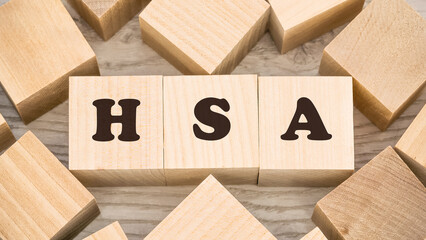 black letters hsa on wooden cubes and numerous empty details