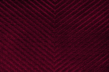 Closeup red color fabric texture. Fabric Herringbone pattern Dark Red strip line fabric pattern design sample or upholstery abstract background.Hi resolution image.
