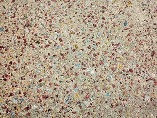 textured background concrete surfaces interspersed with small stones