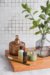Beauty bath rituals with essentials oils, toothbrush and candles