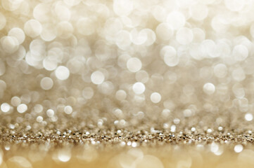 Abstract bokeh golden and yellow colors defocused circular background. Christmas light, new year or...