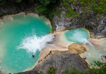 
a turquoise lake among the mountains