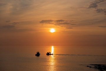 fishing boat at sunset