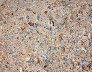 textured background concrete surfaces interspersed with small stones