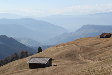 wooden mountain hut in mountain landscape