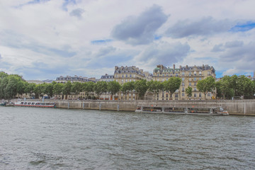 embankment along the Seine river, panoramic view of Paris