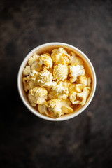 Sweet tasty popcorn in cup.