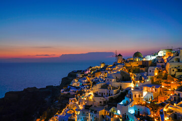 Obraz premium famous view over the village of Oia at the Island Santorini in twilight time, Greece, Europe, Traveling concept