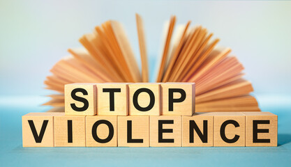 Wooden cubes with the abbreviation Stop Violence - obrazy, fototapety, plakaty