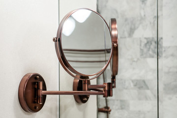 Round wall mirror for the bath. Photo Close-up