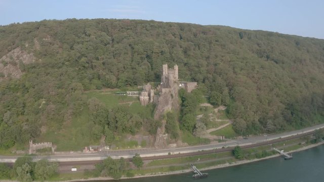 Panorama of Rheinstein Castle on Forested Summer Hill