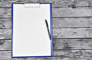 Clipboard with blank white paper with pen