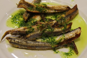 Fried anchovies typical of Spain, pescadito frito. Spanish boquerones fritos
