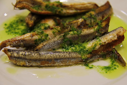 Fried anchovies typical of Spain, pescadito frito. Spanish boquerones fritos

