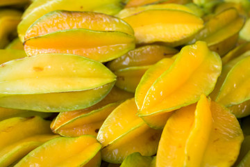 Pile of Fresh Star Apple or Carambola Fruits at the Market