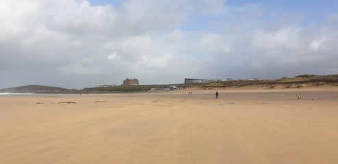 Fototapeta na wymiar Sandy Cornish beach during a windy and wintery British season