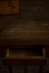 Retro Desk front view. Antique brown wooden table with a drawer. Copy space. Layout