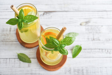 Fototapeta premium Lemonade with orange and basil