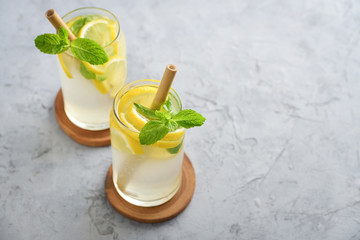 Fototapeta premium Lemonade with lemon and basil