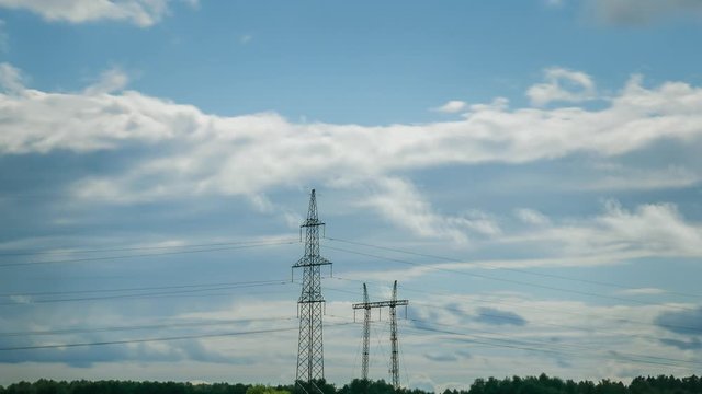high voltage electrical lines, against the background of heavy clouds