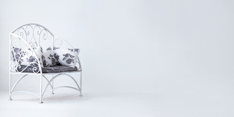 Comfortable openwork metal armchair on white background. Interior element