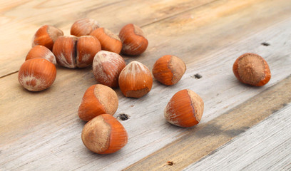 tasty hazelnuts, isolated on wooden board